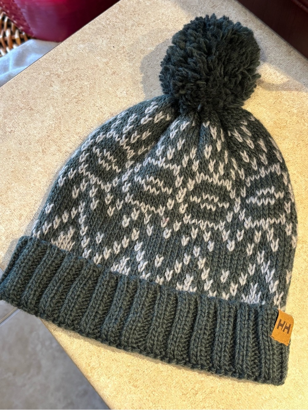 Helly Hansen Kids Pom Beanie in Dark Green and Cream